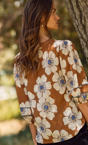 Brown floral top trimmed in blue