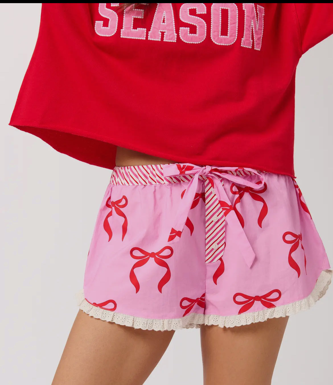 Pink bow boxers trimmed in eyelet and the waist is elastic with candy cane fabric