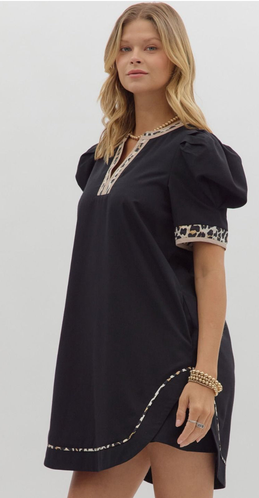 Black dress trimmed with leopard piping lined and pockets