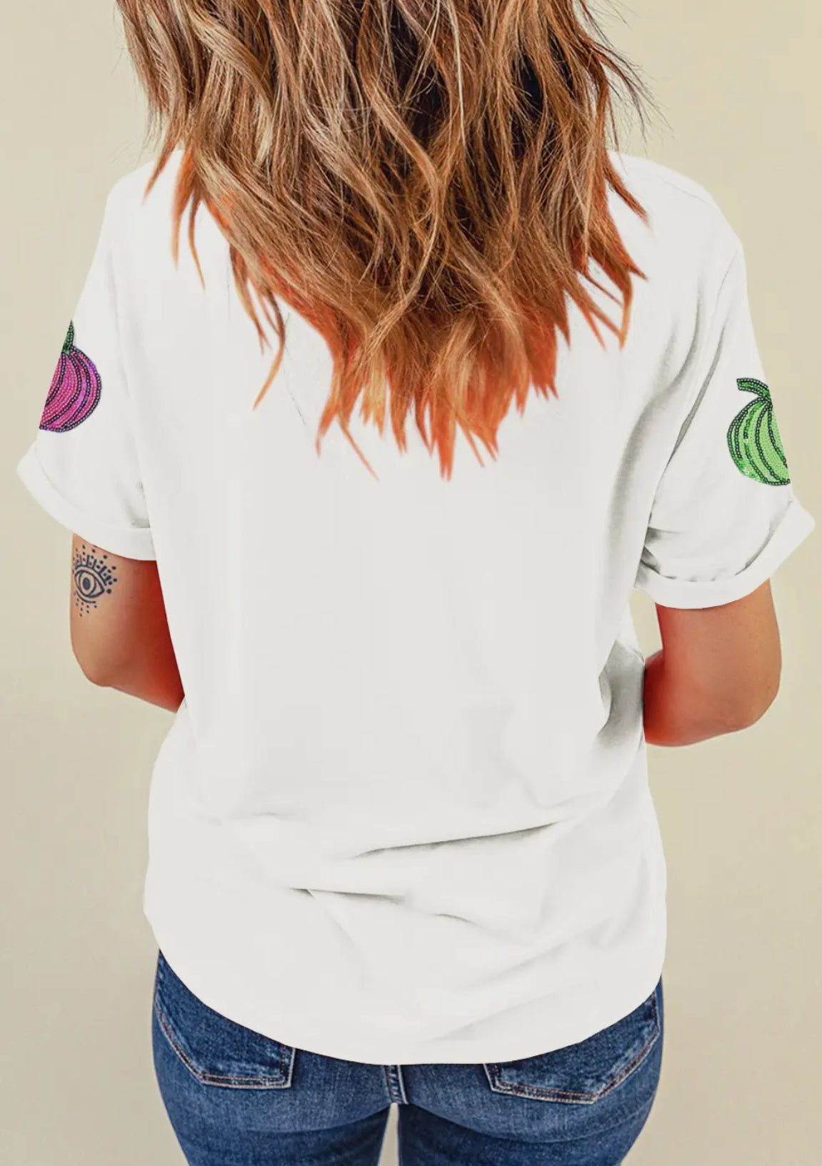 White colored t-shirt with colorful sequined pumpkins