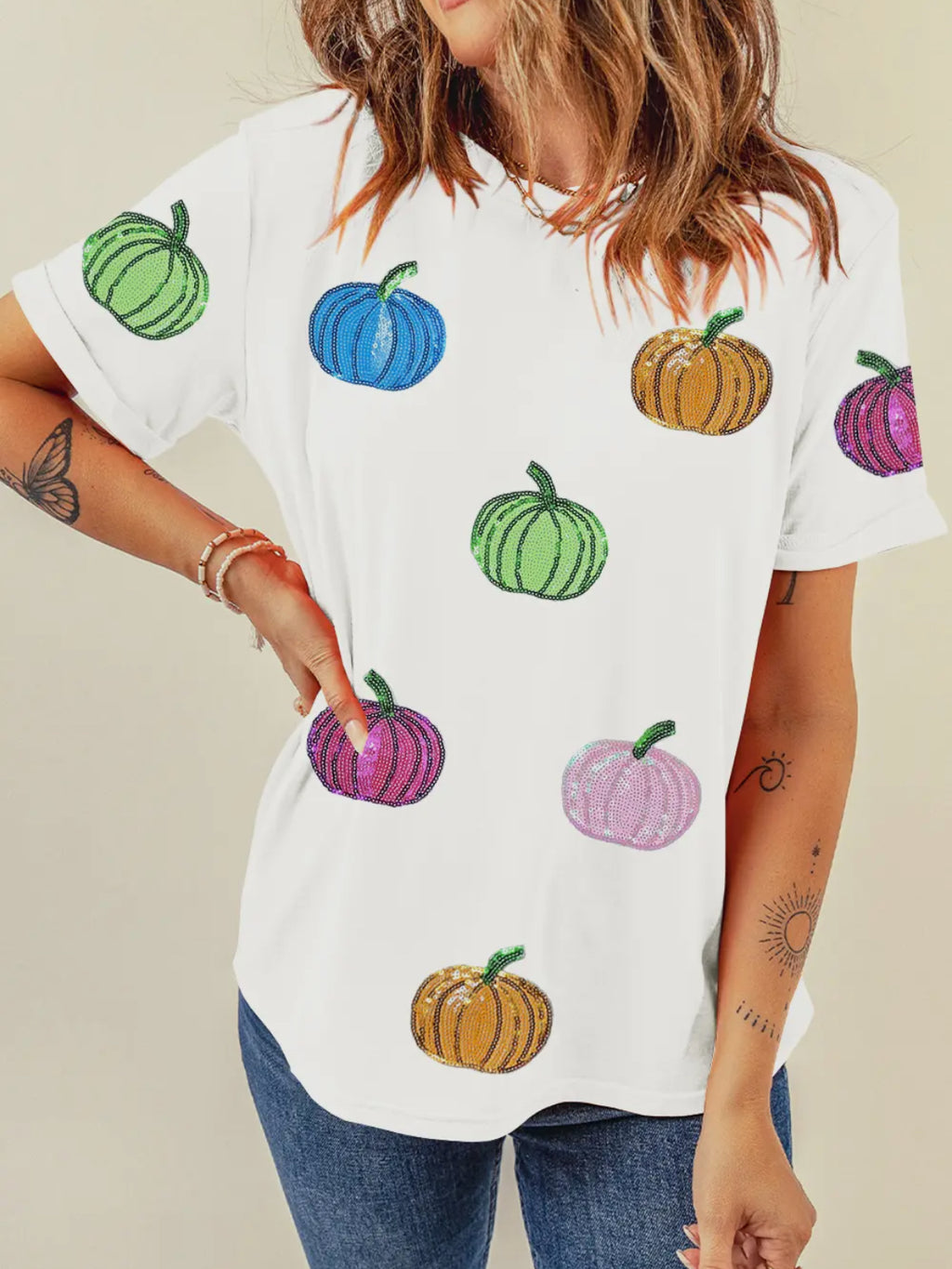 White colored t-shirt with colorful sequined pumpkins