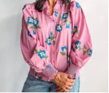 Pink ruffle top with smocked wrist bands
