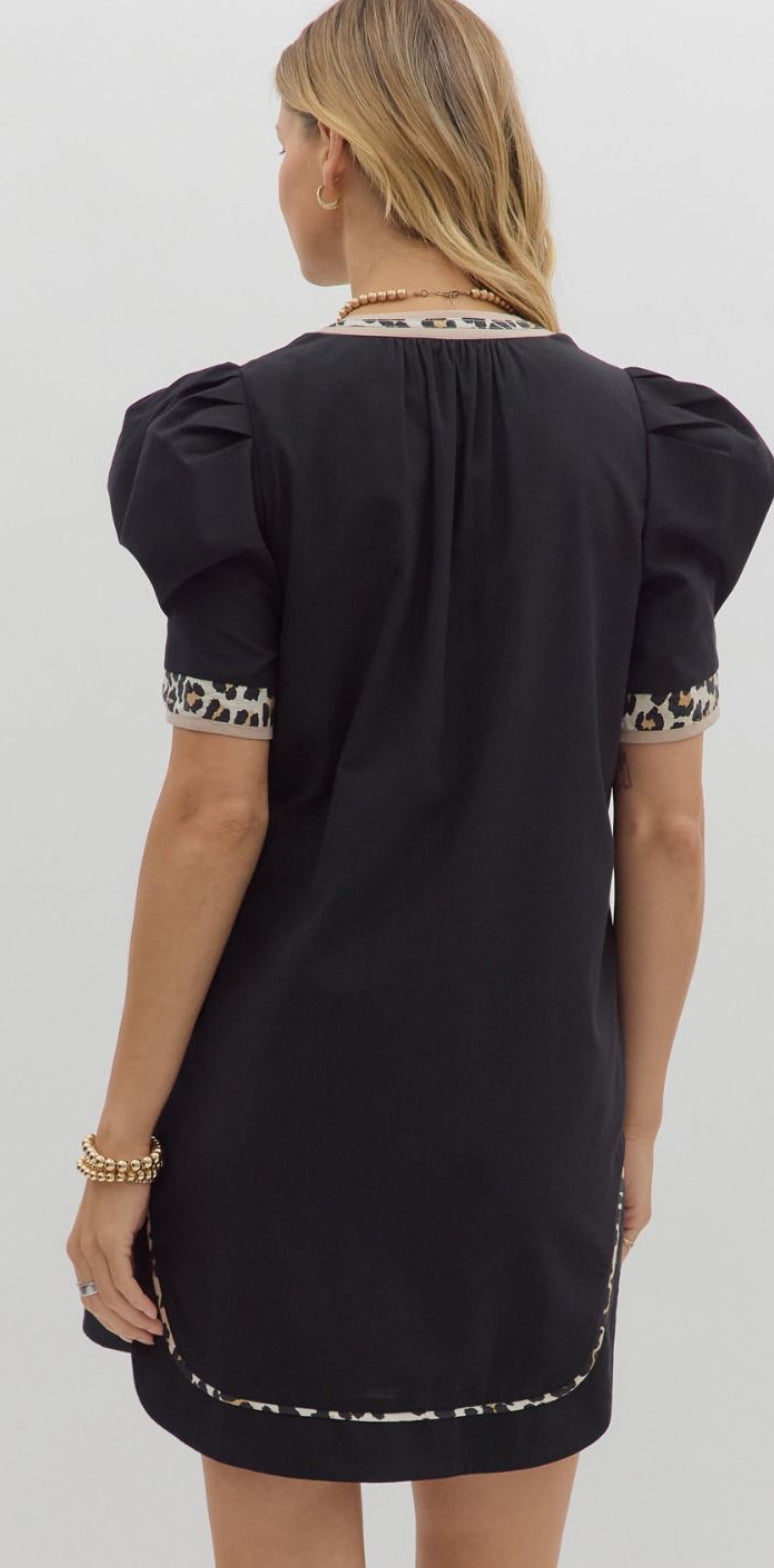Black dress trimmed with leopard piping lined and pockets