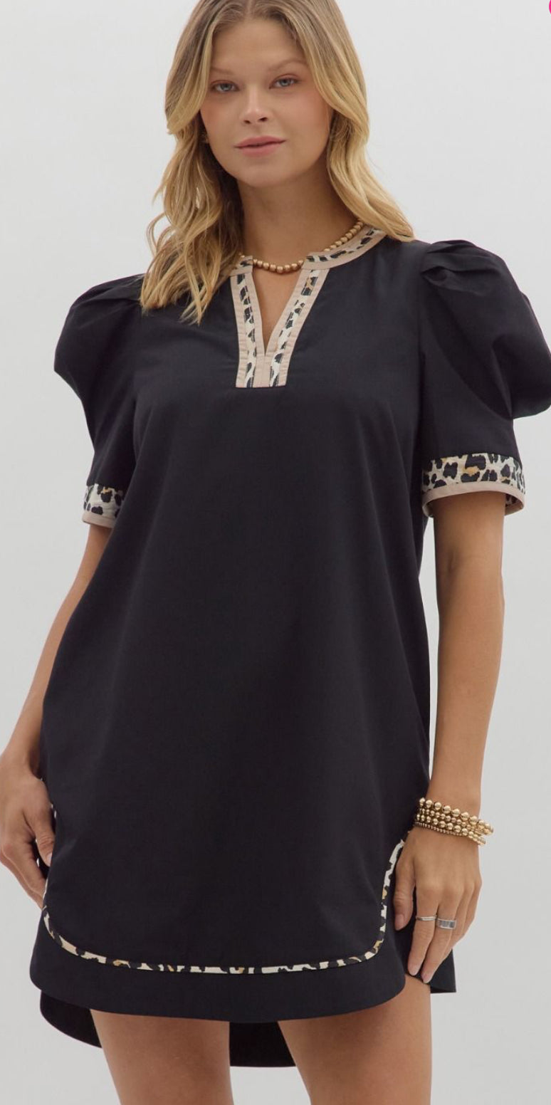 Black dress trimmed with leopard piping lined and pockets