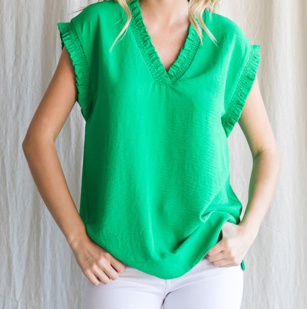 Solid green ruffled trimmed top