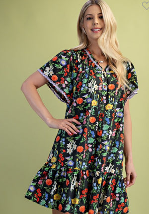 Black floral dress trimmed in lilac ric rac(lined)