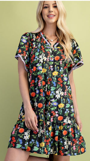 Black floral dress trimmed in lilac ric rac(lined)
