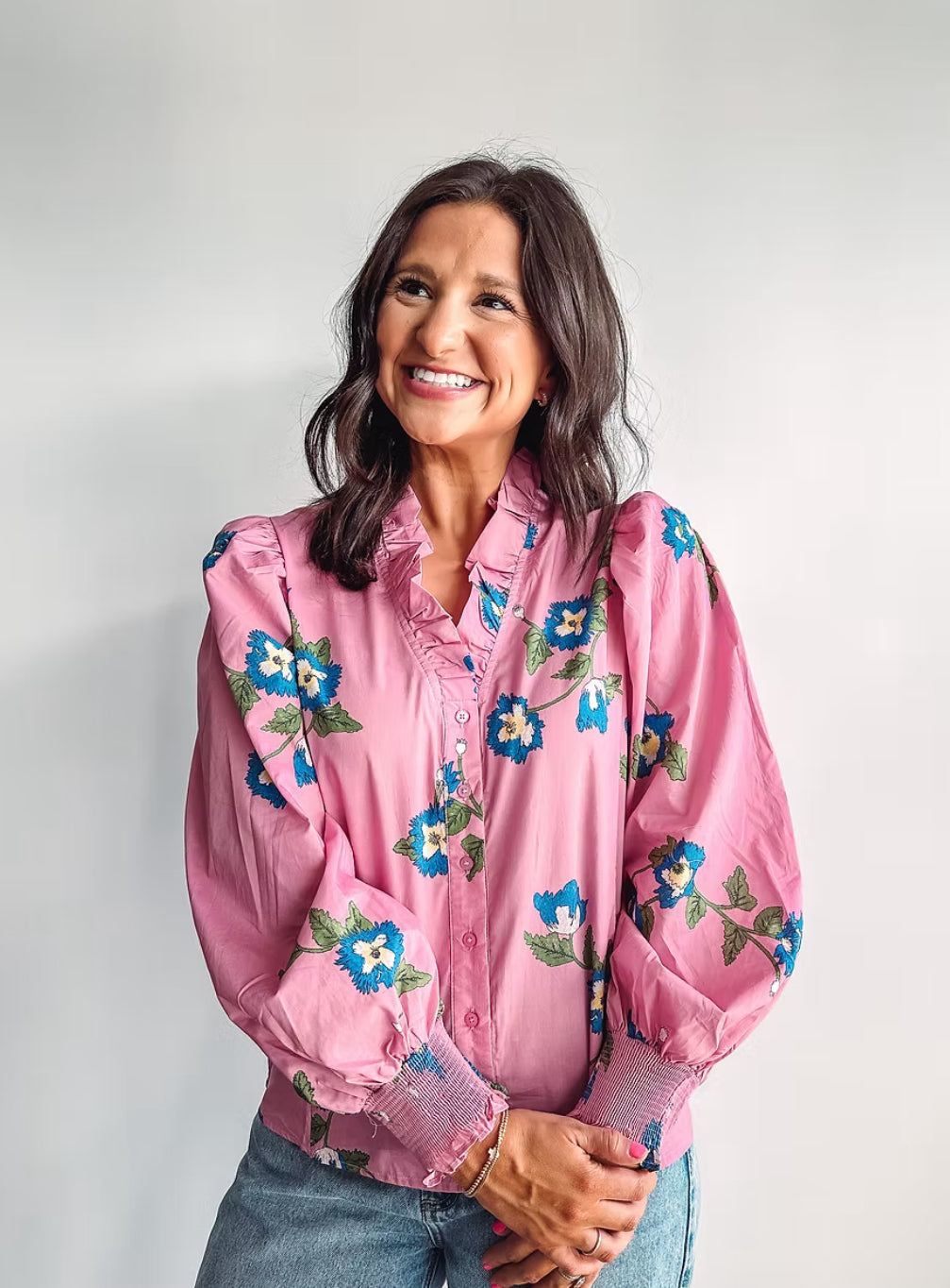 Pink ruffle top with smocked wrist bands