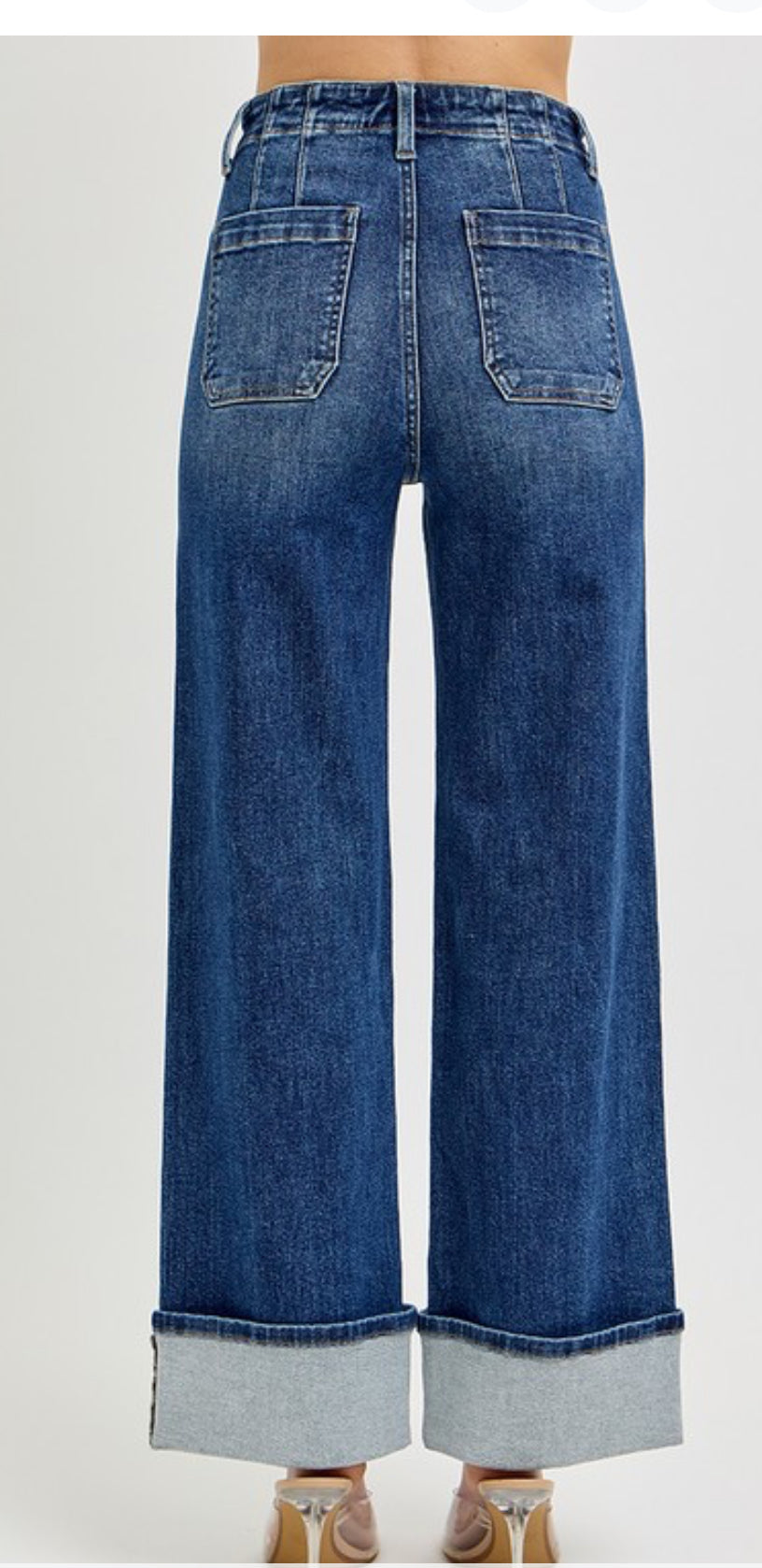 High rise, button down denim jeans with front patch pocket wide ankle cuffed